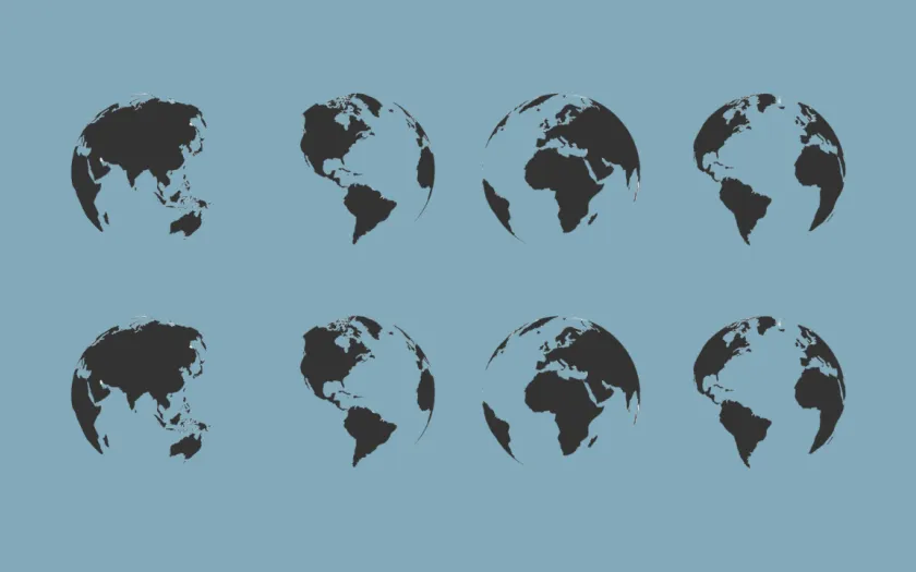 A imagem mostra vários globos terrestres lado a lado, sob um fundo neutro. Crédito: Shutterstock