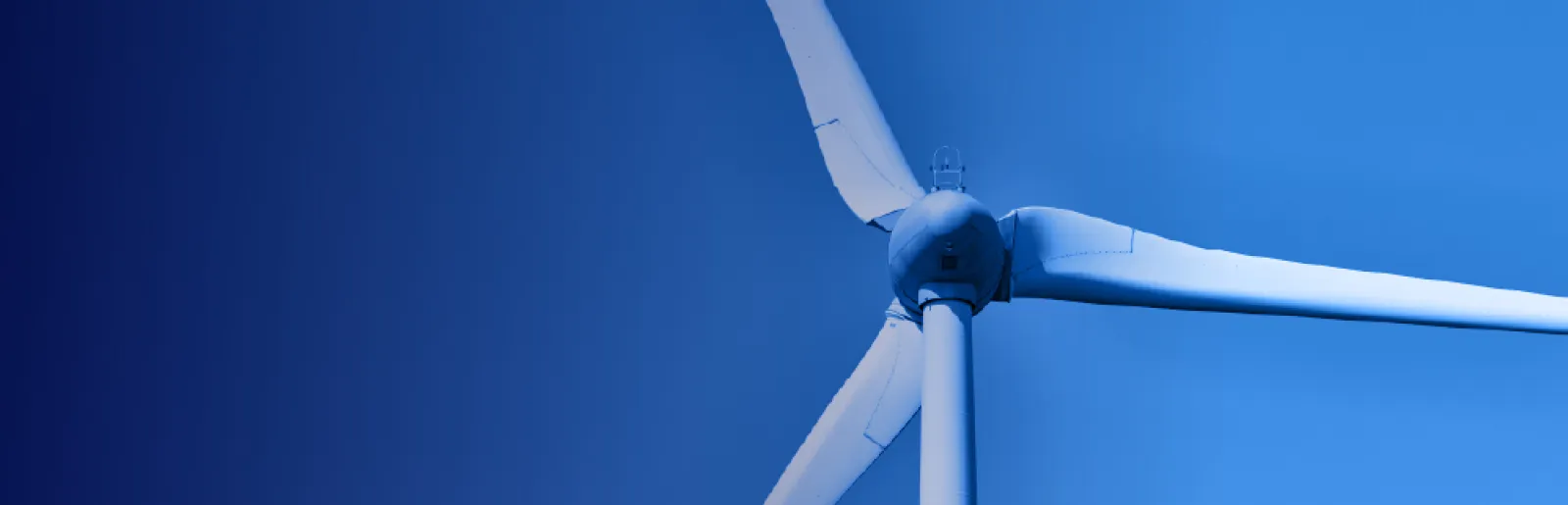 Imagem de uma turbina eólica sobre um fundo azul. 