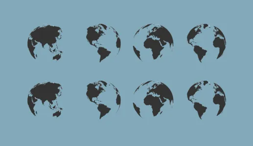A imagem mostra vários globos terrestres lado a lado, sob um fundo neutro. Crédito: Shutterstock